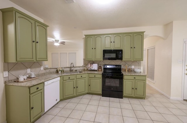 8729 Shavano Dr, Fort Worth, TX 76123 - kitchen with black appliances and green cabinetry