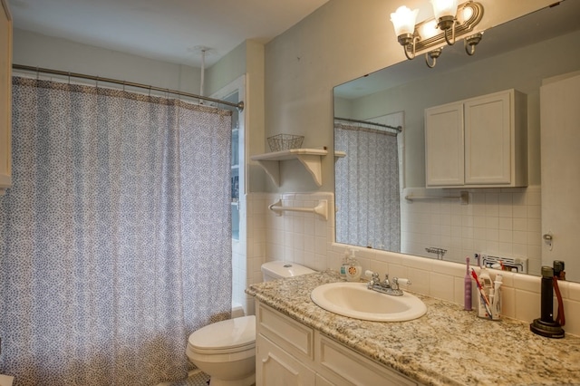 bathroom featuring a notable chandelier, tile walls, toilet, shower / tub combo with curtain, and vanity