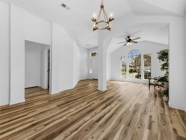 4512 Stepping Stone Dr, Fort Worth, TX 76123 - unfurnished living room featuring vaulted ceiling, light wood finished floors, baseboards, ceiling fan with notable chandelier, and visible vents