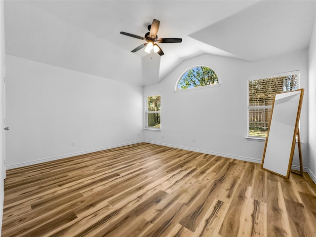 4512 Stepping Stone Dr, Fort Worth, TX 76123 - empty room featuring baseboards, lofted ceiling, wood finished floors, and a ceiling fan