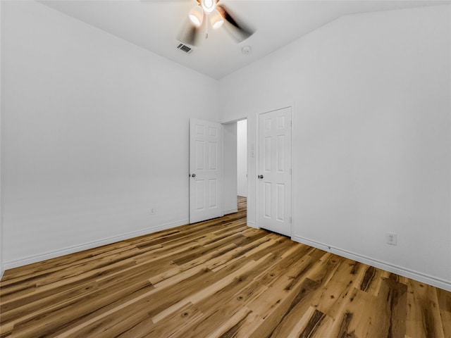 4512 Stepping Stone Dr, Fort Worth, TX 76123 - spare room featuring wood finished floors, lofted ceiling, baseboards, visible vents, and ceiling fan