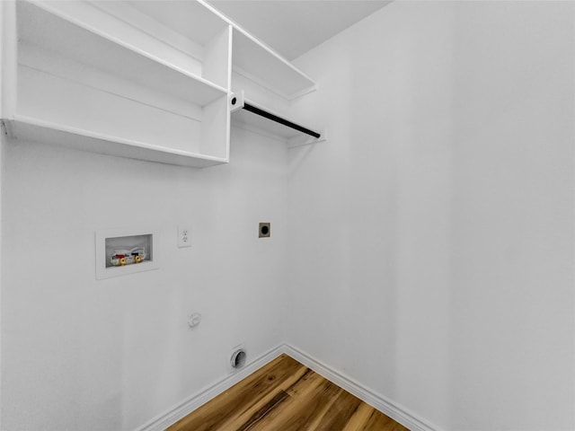 4512 Stepping Stone Dr, Fort Worth, TX 76123 - laundry area with wood finished floors, electric dryer hookup, laundry area, baseboards, and hookup for a washing machine