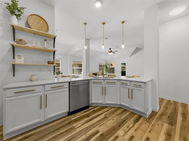 4512 Stepping Stone Dr, Fort Worth, TX 76123 - kitchen with hanging light fixtures, light countertops, light wood-style floors, and dishwasher