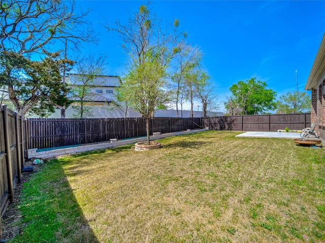 view of yard with a fenced backyard