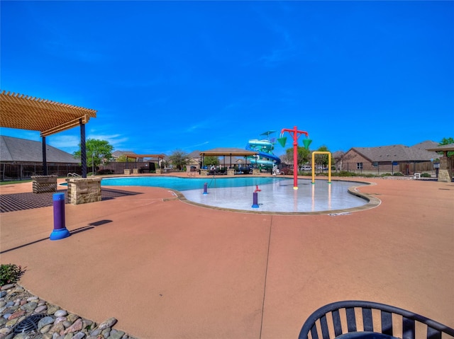 pool featuring fence, a patio, a gazebo, a water play area, and a pergola