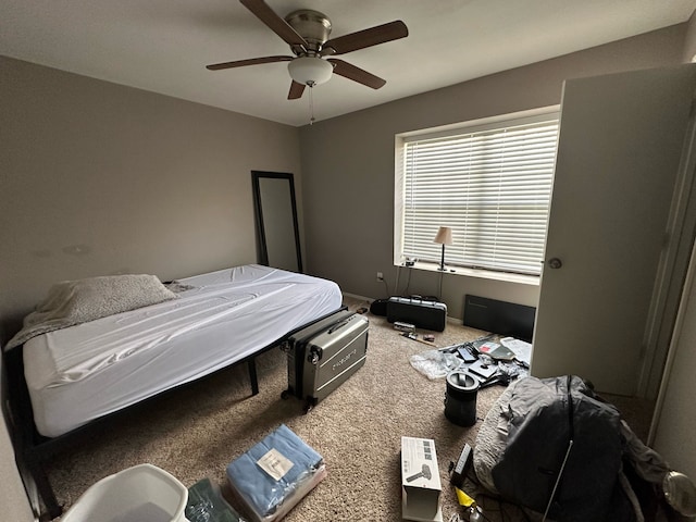 bedroom featuring baseboards, ceiling fan, and carpet floors