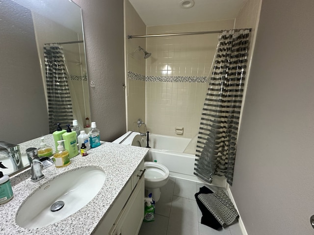 bathroom featuring toilet, tile patterned floors, vanity, shower / tub combo, and a textured wall