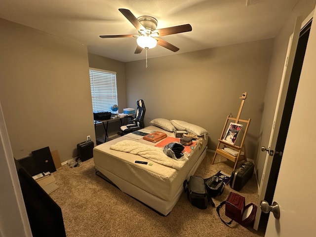 bedroom featuring carpet flooring, baseboards, and ceiling fan