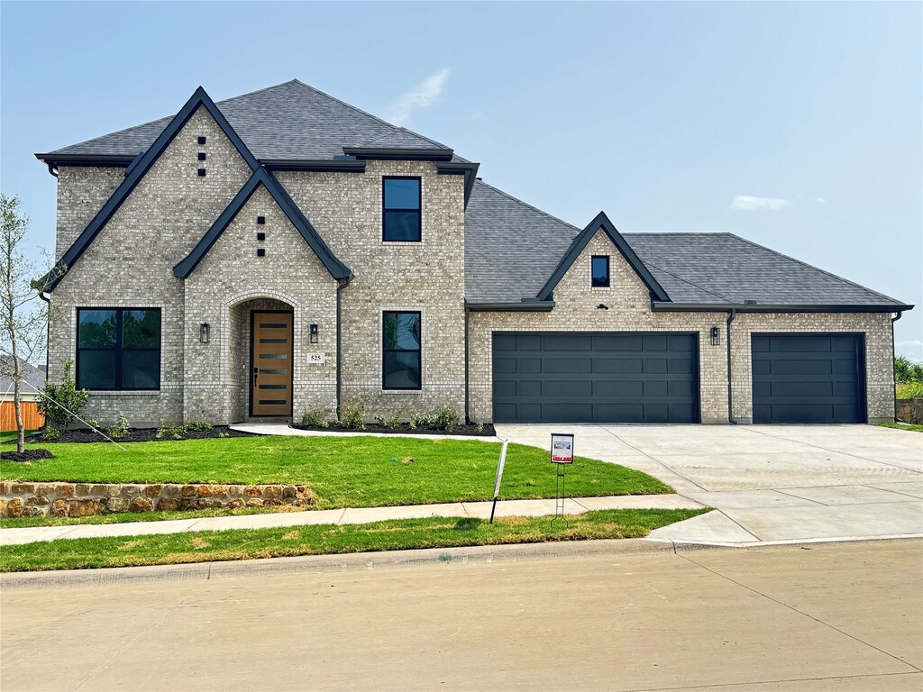 525 Windchase Dr, Haslet, TX 76052 - view of side of home with brick siding and a garage