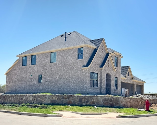 525 Windchase Dr, Haslet, TX 76052 - view of side of home with brick siding and a garage