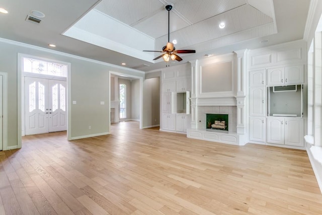 4908 Meandering Way, Colleyville, TX 76034 - unfurnished living room featuring ornamental molding, light wood-type flooring, ceiling fan, a tile fireplace, and baseboards