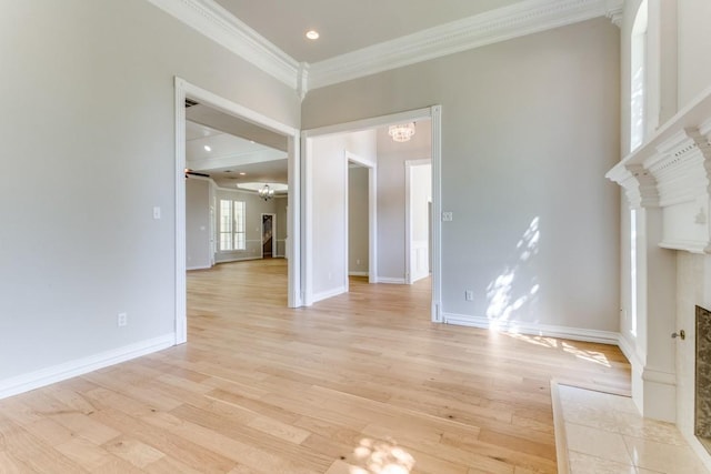 4908 Meandering Way, Colleyville, TX 76034 - unfurnished living room featuring a premium fireplace, ornamental molding, a ceiling fan, light wood-style flooring, and baseboards