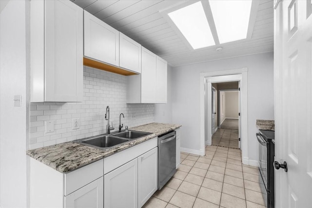 120 Southwinds Dr, Weatherford, TX 76087 - kitchen with stainless steel dishwasher, a skylight, a sink, black range with electric cooktop, and backsplash