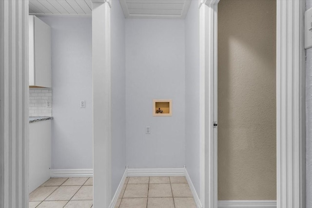 120 Southwinds Dr, Weatherford, TX 76087 - washroom featuring light tile patterned floors, laundry area, washer hookup, and baseboards