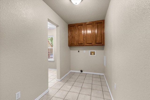120 Southwinds Dr, Weatherford, TX 76087 - laundry area featuring a textured wall, electric dryer hookup, hookup for a washing machine, and cabinet space
