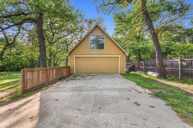 120 Southwinds Dr, Weatherford, TX 76087 - garage featuring driveway, fence, and a garage