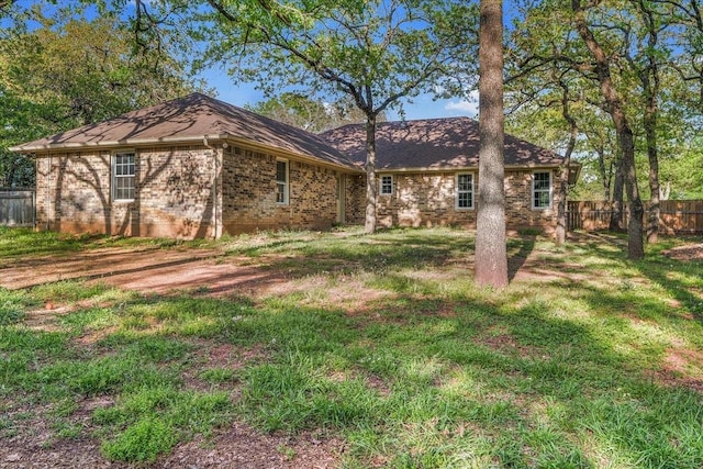 120 Southwinds Dr, Weatherford, TX 76087 - back of house with a yard, fence, and brick siding