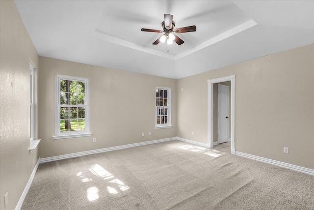 120 Southwinds Dr, Weatherford, TX 76087 - empty room with baseboards, a tray ceiling, light colored carpet, and ceiling fan