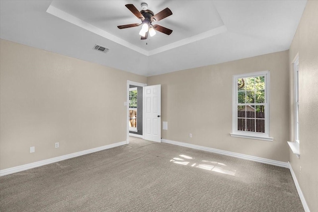 120 Southwinds Dr, Weatherford, TX 76087 - carpeted spare room featuring baseboards, visible vents, a tray ceiling, and a ceiling fan