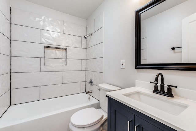 1312 Greenwood Dr, Garland, TX 75041 - bathroom featuring toilet, vanity, and bathing tub / shower combination