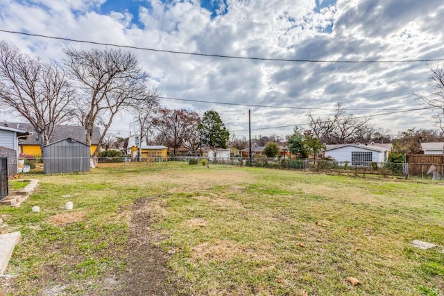 1312 Greenwood Dr, Garland, TX 75041 - view of yard with an outdoor structure and fence