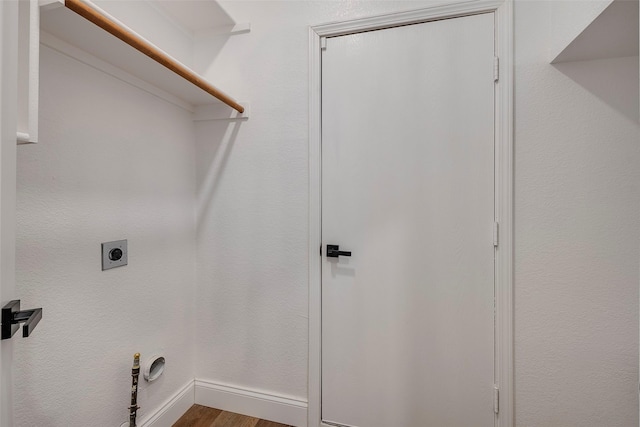 10 Monticello Ct, Mansfield, TX 76063 - laundry area with electric dryer hookup, wood finished floors, and baseboards