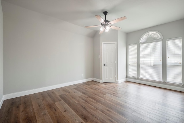 10 Monticello Ct, Mansfield, TX 76063 - empty room with a ceiling fan, wood finished floors, baseboards, and vaulted ceiling