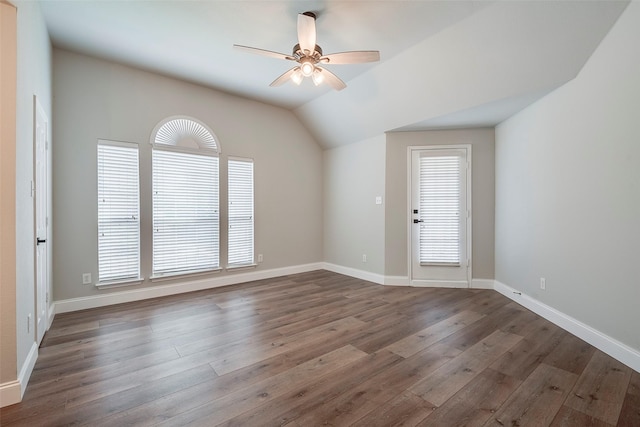10 Monticello Ct, Mansfield, TX 76063 - unfurnished room featuring ceiling fan, dark wood-style flooring, vaulted ceiling, and baseboards