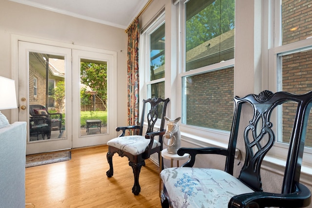 241 Tanbark Cir, Coppell, TX 75019 - sitting room with wood finished floors and ornamental molding