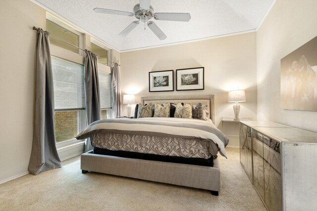 241 Tanbark Cir, Coppell, TX 75019 - bedroom with light colored carpet, ornamental molding, baseboards, and a ceiling fan
