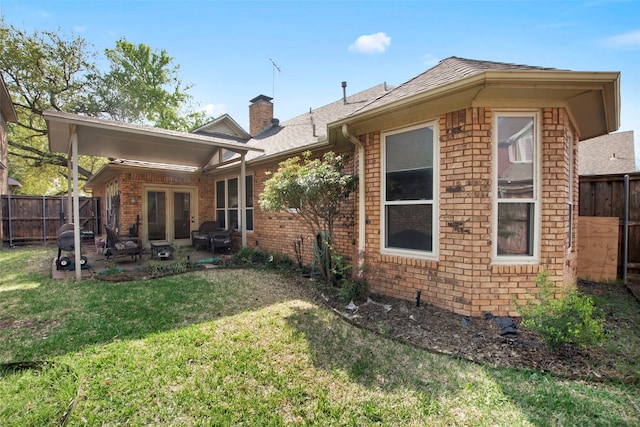 241 Tanbark Cir, Coppell, TX 75019 - rear view of house featuring brick siding, a patio area, a chimney, and roof with shingles
