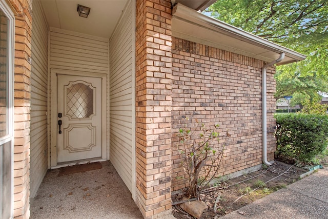241 Tanbark Cir, Coppell, TX 75019 - view of exterior entry featuring brick siding