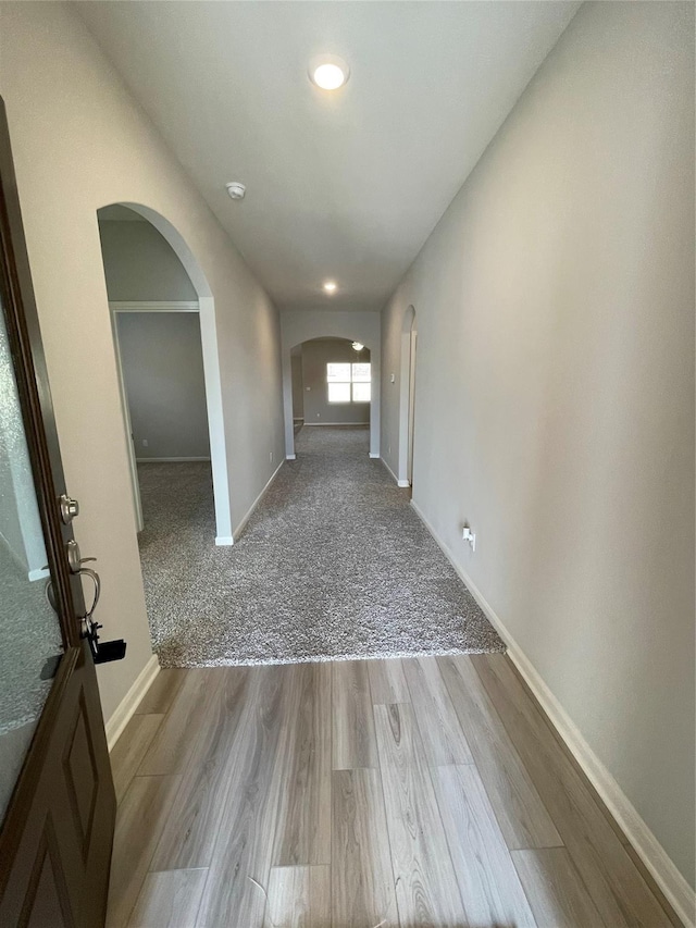 2100 Yarbrough, Anna, TX 75409 - interior space featuring baseboards, wood finished floors, and arched walkways