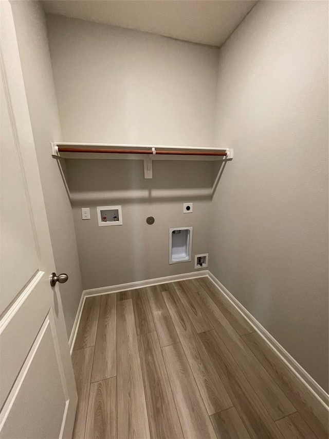 2100 Yarbrough, Anna, TX 75409 - laundry area featuring wood finished floors, baseboards, electric dryer hookup, laundry area, and washer hookup