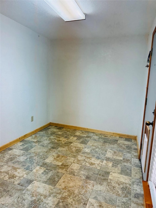 308 Hallvale Dr, White Settlement, TX 76108 - spare room with baseboards and stone finish floors