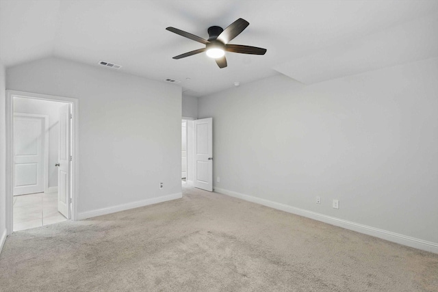 unfurnished bedroom featuring carpet, baseboards, a ceiling fan, and lofted ceiling