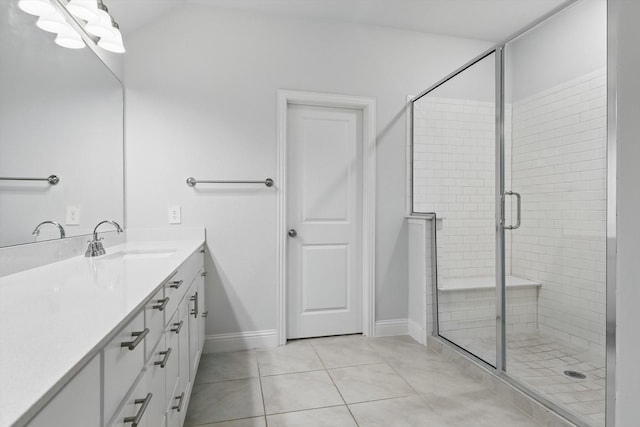 full bathroom with tile patterned floors, a shower stall, vanity, and baseboards