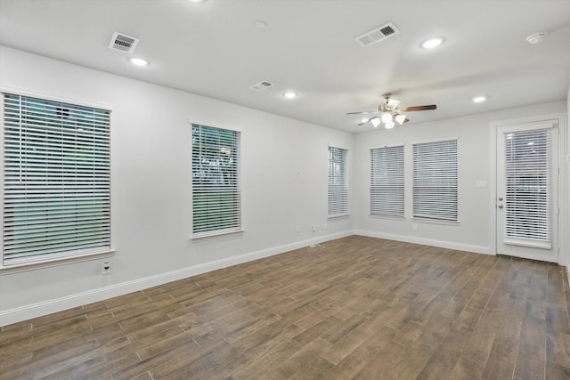 unfurnished room with wood finished floors, ceiling fan, baseboards, recessed lighting, and a smoke detector