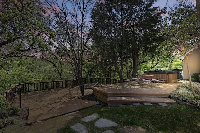 view of yard featuring a hot tub and a wooden deck
