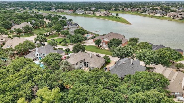 birds eye view of property with a water view and a residential view