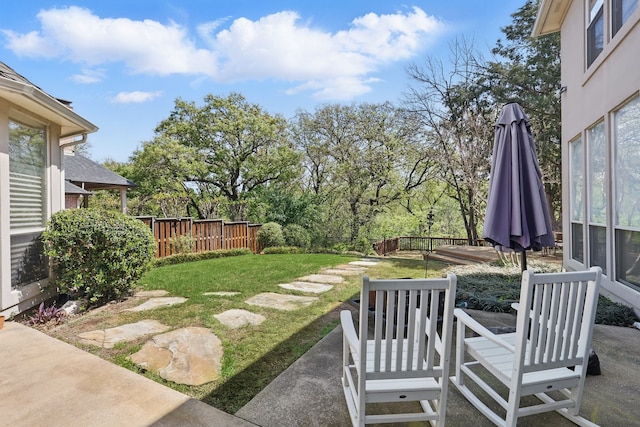 view of yard with a patio and fence
