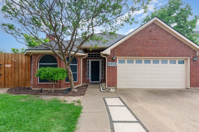4315 Elgin Ct, Grand Prairie, TX 75052 - view of front of house featuring brick siding, driveway, an attached garage, fence, and a shingled roof