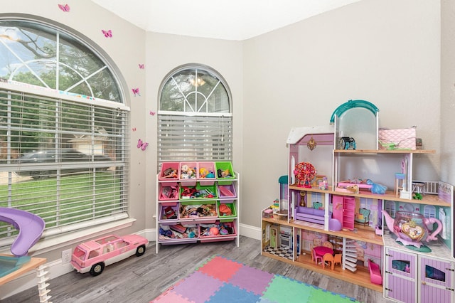 4315 Elgin Ct, Grand Prairie, TX 75052 - rec room with wood finished floors and baseboards