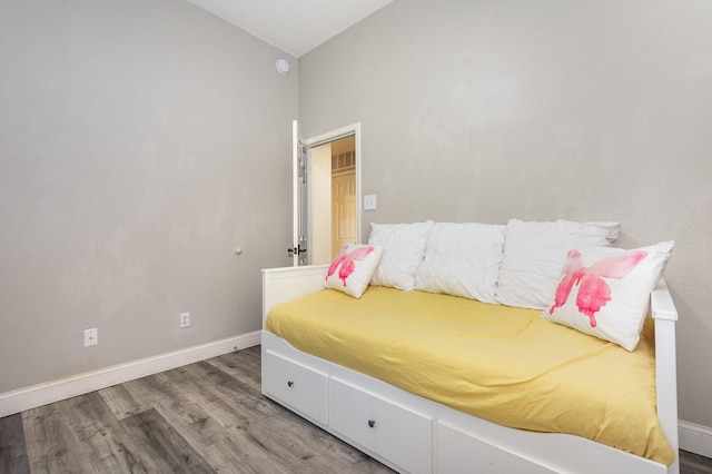 4315 Elgin Ct, Grand Prairie, TX 75052 - bedroom with wood finished floors, baseboards, and lofted ceiling