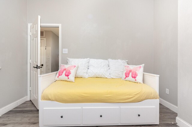 4315 Elgin Ct, Grand Prairie, TX 75052 - bedroom featuring baseboards and wood finished floors