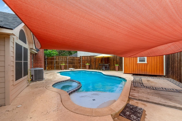4315 Elgin Ct, Grand Prairie, TX 75052 - view of swimming pool featuring central air condition unit, a fenced backyard, a patio, a diving board, and a pool with connected hot tub
