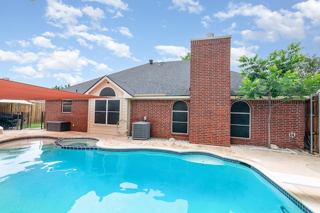 4315 Elgin Ct, Grand Prairie, TX 75052 - view of pool with fence, a patio, central AC, and a pool with connected hot tub