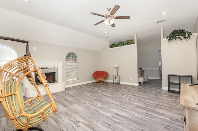 4315 Elgin Ct, Grand Prairie, TX 75052 - sitting room featuring ceiling fan, light wood-type flooring, recessed lighting, a fireplace, and vaulted ceiling