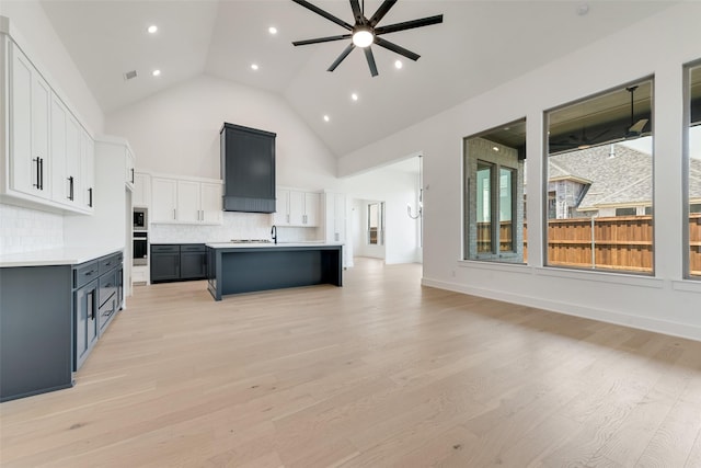 814 Montrose Dr, Rockwall, TX 75087 - kitchen featuring open floor plan, ceiling fan, backsplash, light countertops, and appliances with stainless steel finishes