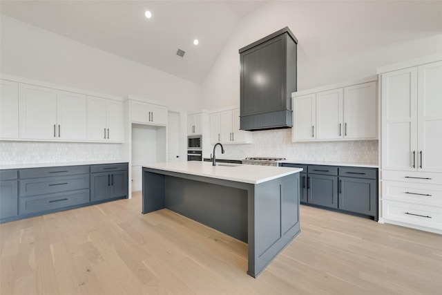 814 Montrose Dr, Rockwall, TX 75087 - kitchen with high vaulted ceiling, backsplash, a sink, light countertops, and oven